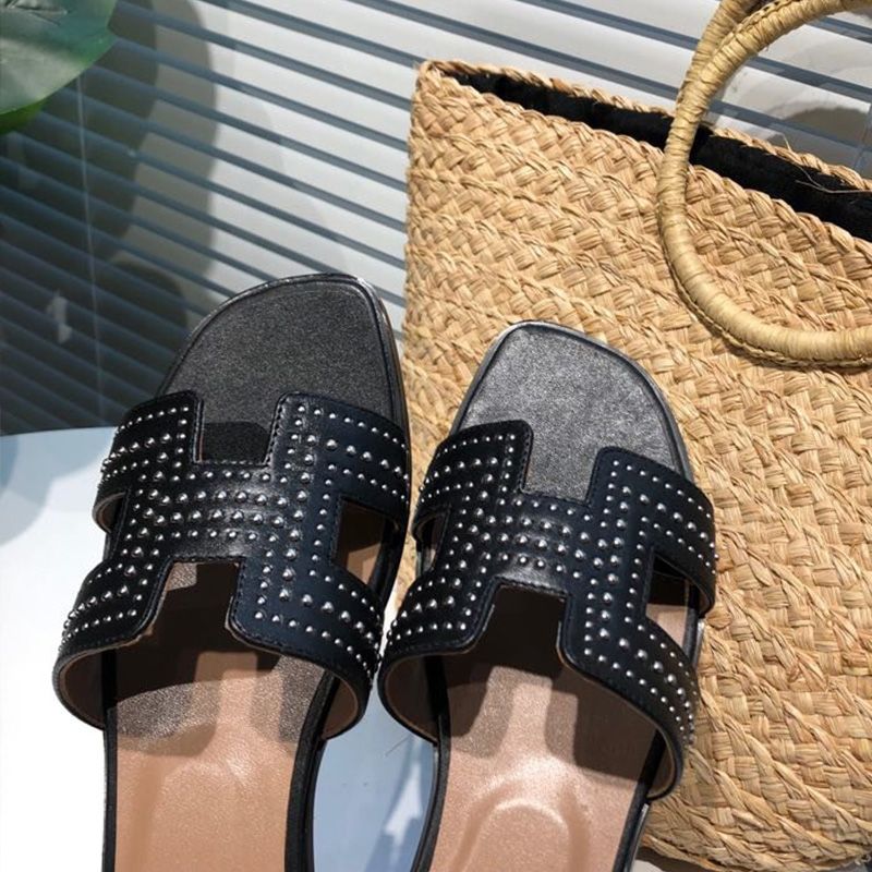 Hermes Oran Slides Women Palladium Studs Calfskin In Black