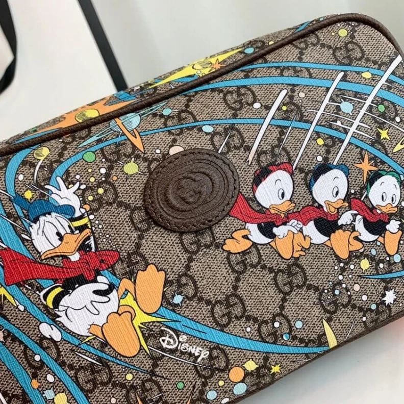 Replica bags Legendary Disney x Gucci Donald Duck Print Belt Bag