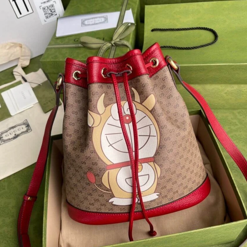 Replica bags lv Shiny gol Doraemon x Gucci Small Bucket Bag