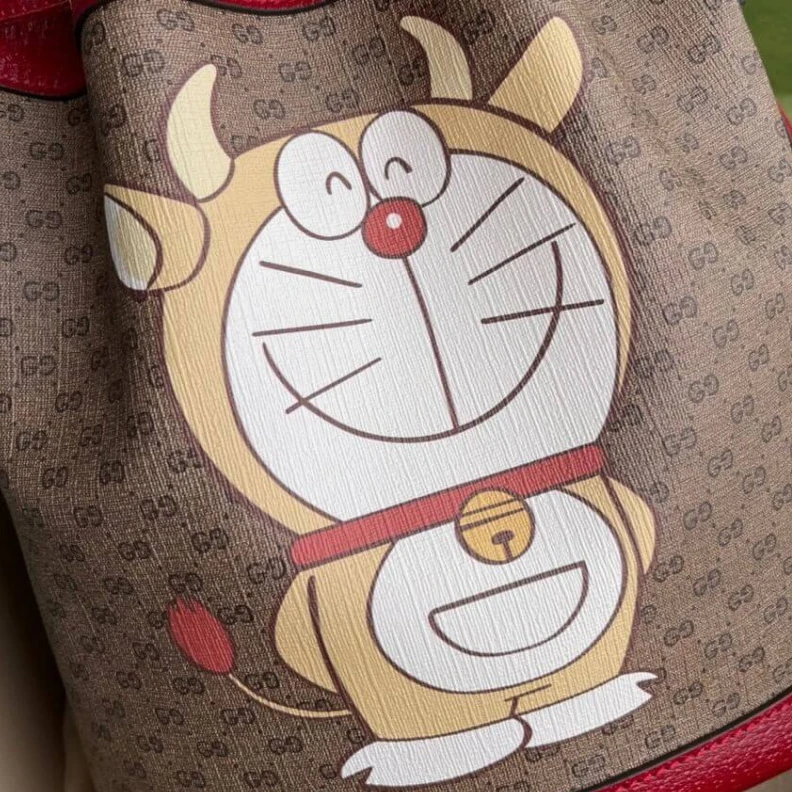 Replica bags lv Shiny gol Doraemon x Gucci Small Bucket Bag