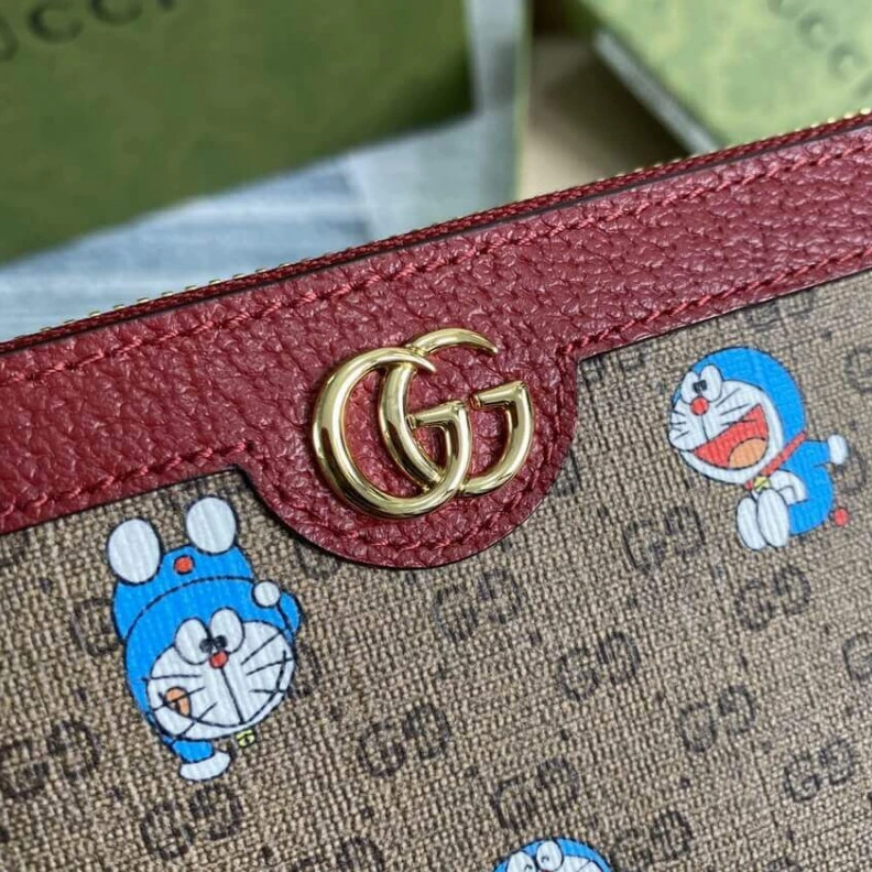 Replica bags Twelve ca Doraemon x Gucci Zip Around Wallet 647787 in Blue