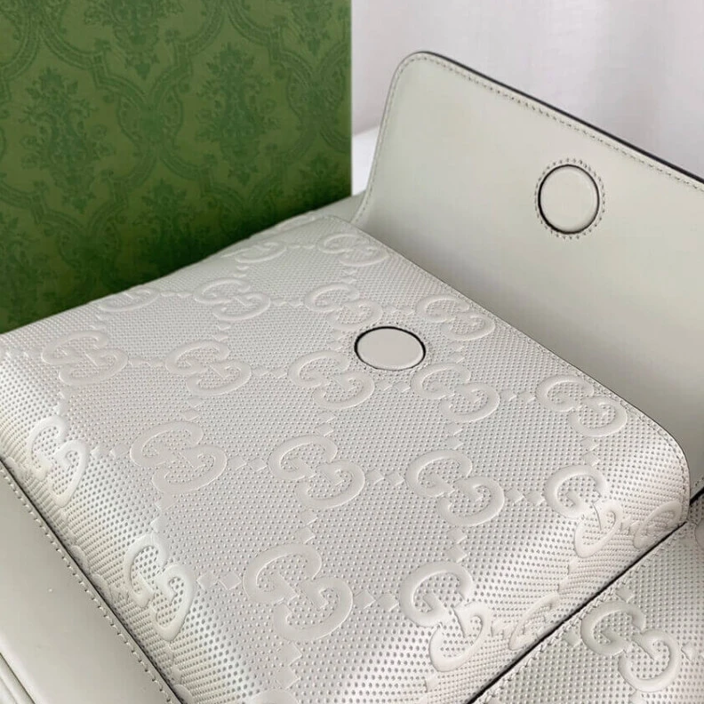 Louis vuitton locations Tonal lea Gucci GG Embossed Backpack in White Leather