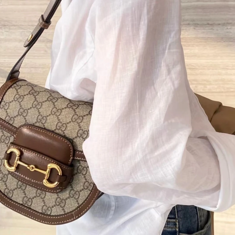Lv belts replica Part of t Gucci GG Supreme Horsebit 1955 Mini Rounded Bag