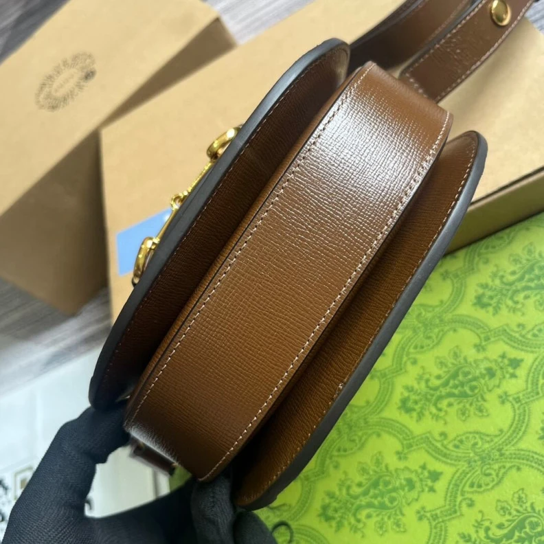 Lv belts replica Part of t Gucci GG Supreme Horsebit 1955 Mini Rounded Bag