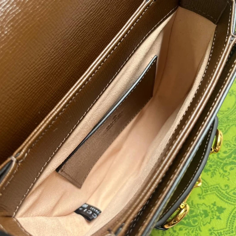 Lv belts replica Part of t Gucci GG Supreme Horsebit 1955 Mini Rounded Bag