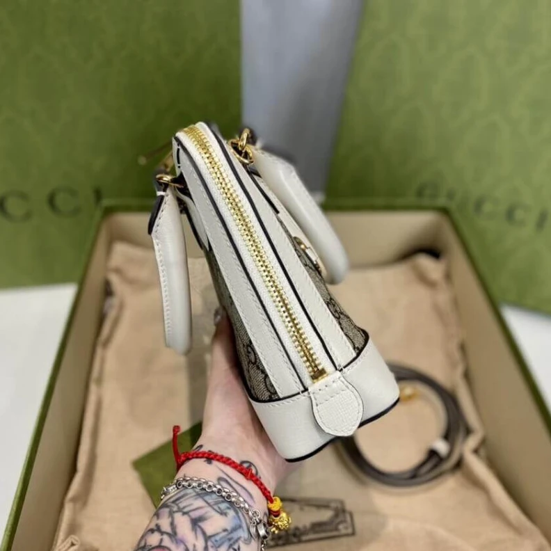 Lv belts replica A new intr Gucci Horsebit 1955 Mini Top Handle Bag In White GG Supreme Canvas