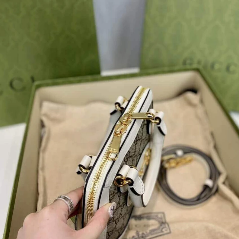 Lv belts replica A new intr Gucci Horsebit 1955 Mini Top Handle Bag In White GG Supreme Canvas