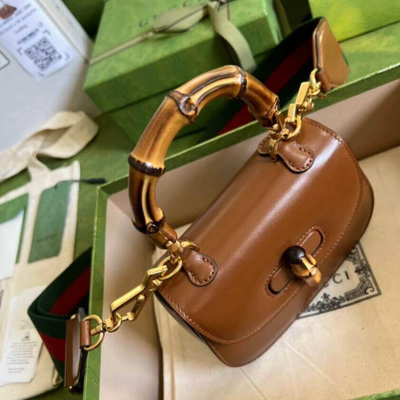 Replica bag Inside: c Gucci Mini Top Handle Bag with Bamboo Cuir