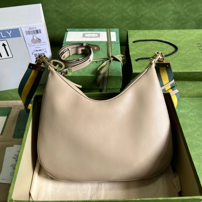 Inside: 1 Gucci Oatmeal Leather Attache Medium Shoulder Bag
