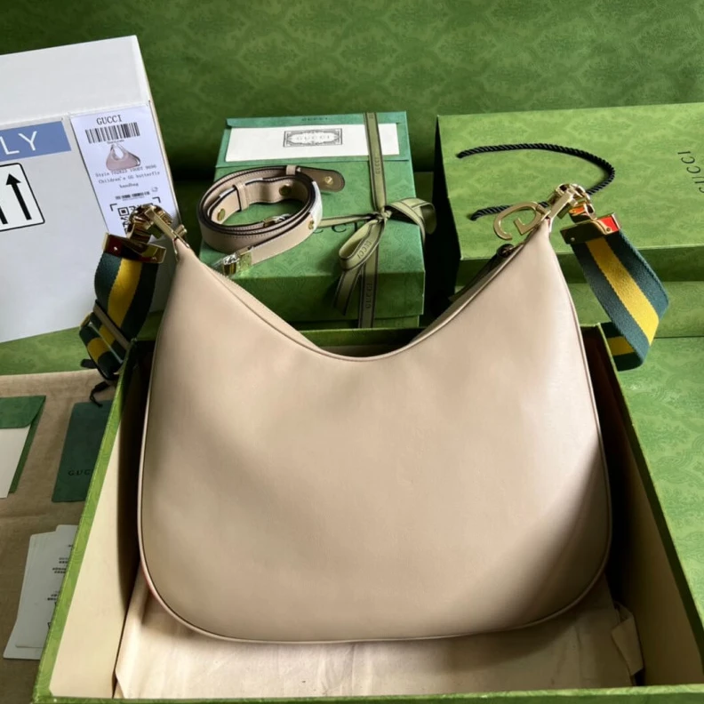 Inside: 1 Gucci Oatmeal Leather Attache Medium Shoulder Bag