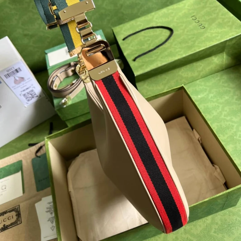 Inside: 1 Gucci Oatmeal Leather Attache Medium Shoulder Bag