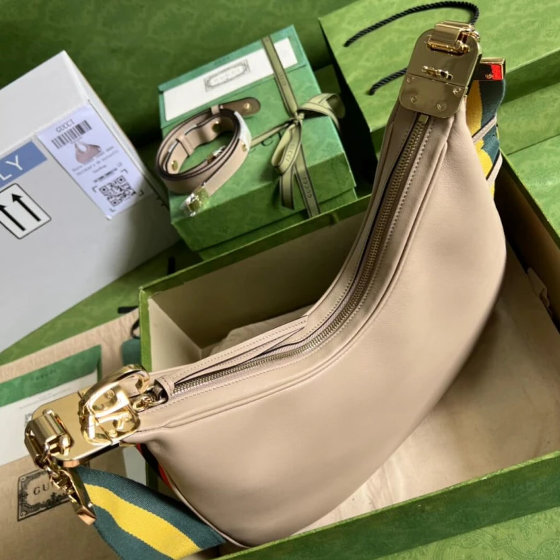 Inside: 1 Gucci Oatmeal Leather Attache Medium Shoulder Bag