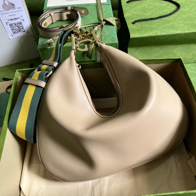 Inside: 1 Gucci Oatmeal Leather Attache Medium Shoulder Bag