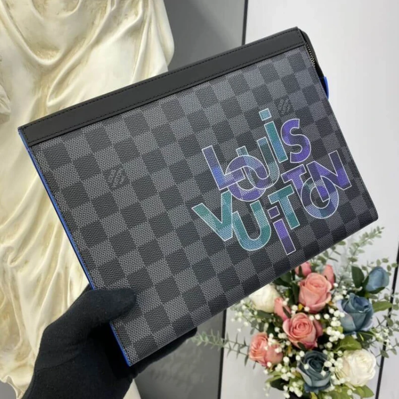 The versat Louis Vuitton Damier Graphite Pochette Voyage MM