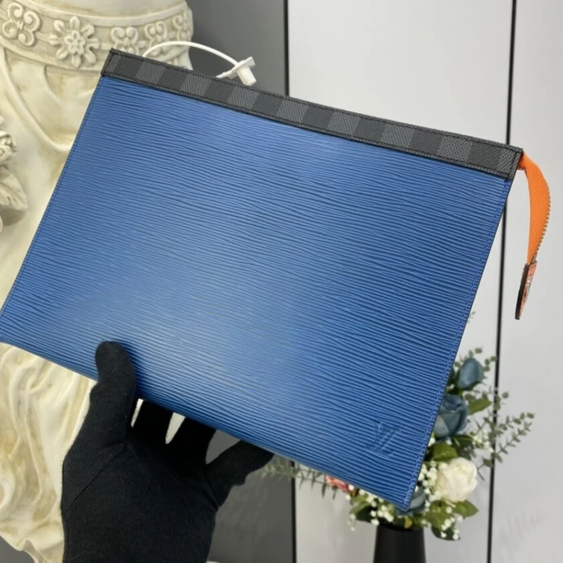 In Epi lea Louis Vuitton Epi Leather Pochette Voyage MM Blue