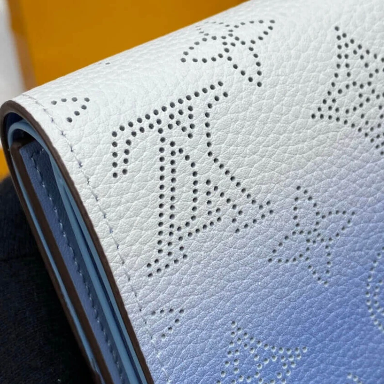 Replica bag 1 zipped Louis Vuitton Iris Compact Wallet in Blue Gradient Mahina Perforated Leather