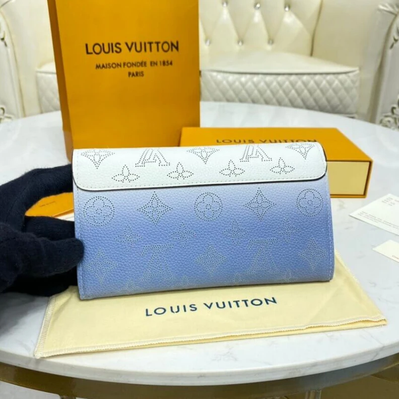 Louis vuitton locations 2 large c Louis Vuitton Iris Wallet in Blue Gradient Mahina Perforated Leather