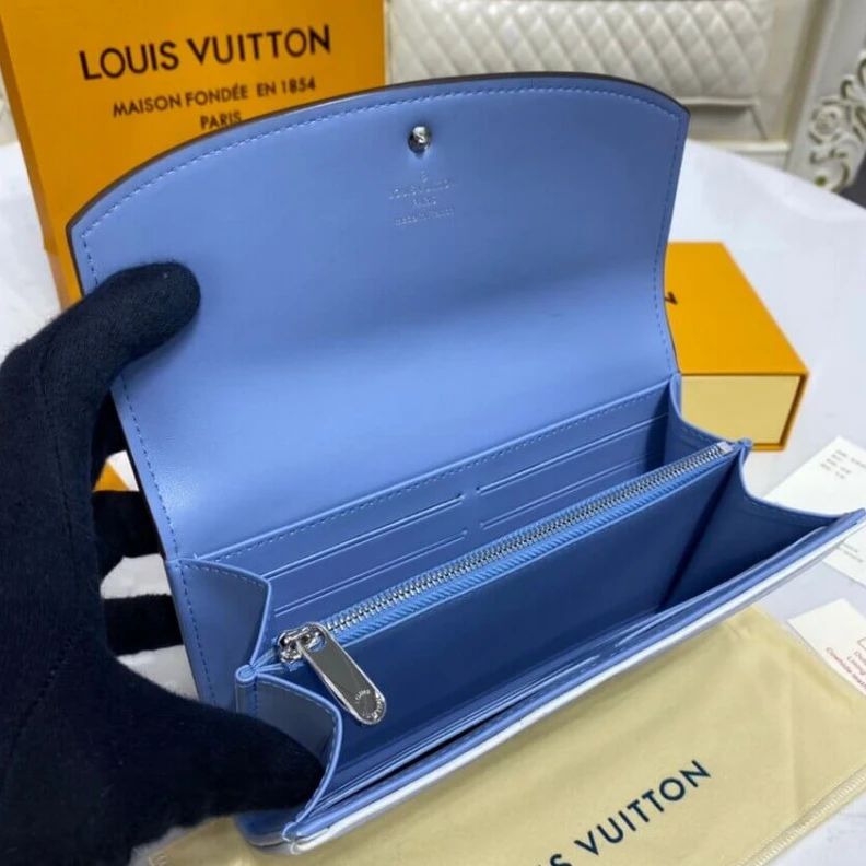 Louis vuitton locations 2 large c Louis Vuitton Iris Wallet in Blue Gradient Mahina Perforated Leather