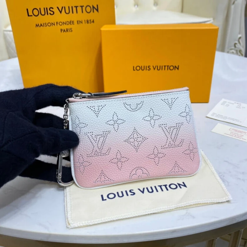 Key ring Louis Vuitton Key Pouch in Pink Gradient Mahina Perforated Leather
