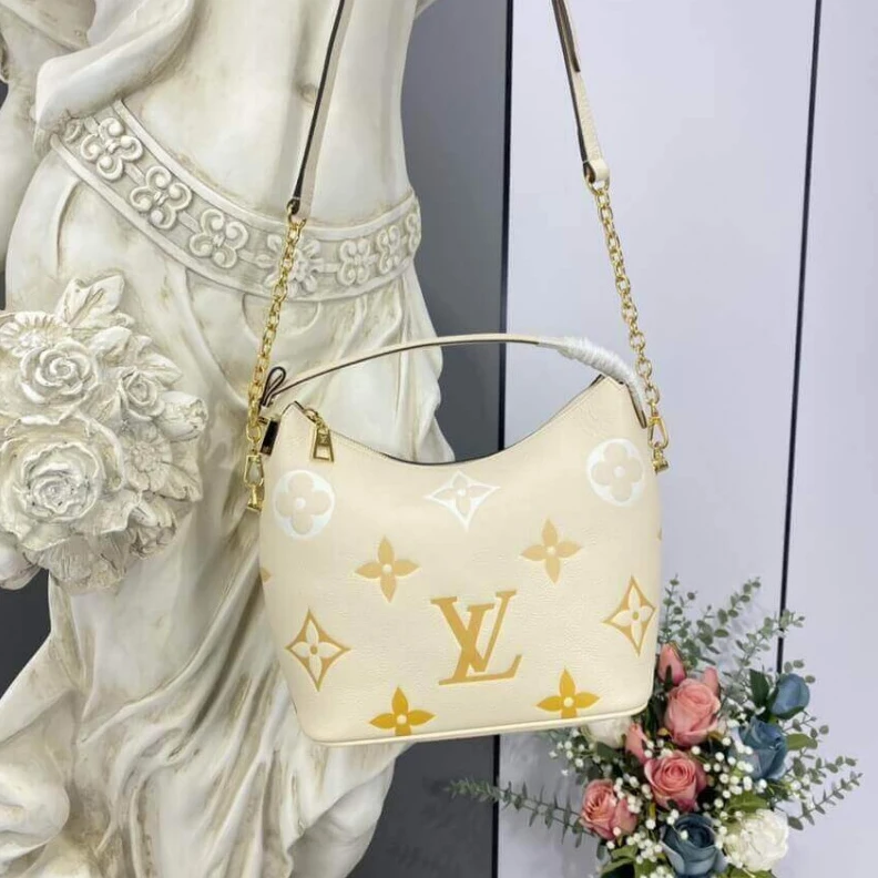 Replica bags lv Handle: S Louis Vuitton Marshmallow Hobo Bag Cream Saffron