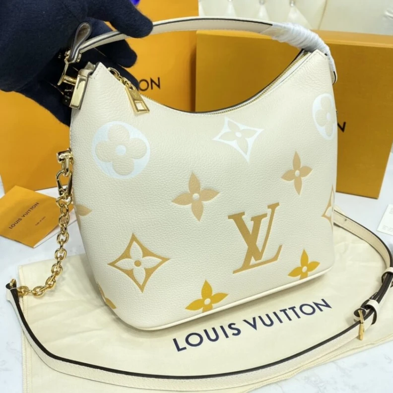 Replica bags lv Handle: S Louis Vuitton Marshmallow Hobo Bag Cream Saffron