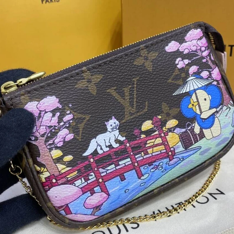 Top lv Chain dro Louis Vuitton Monogram Canvas Mini Pochette Accessoires