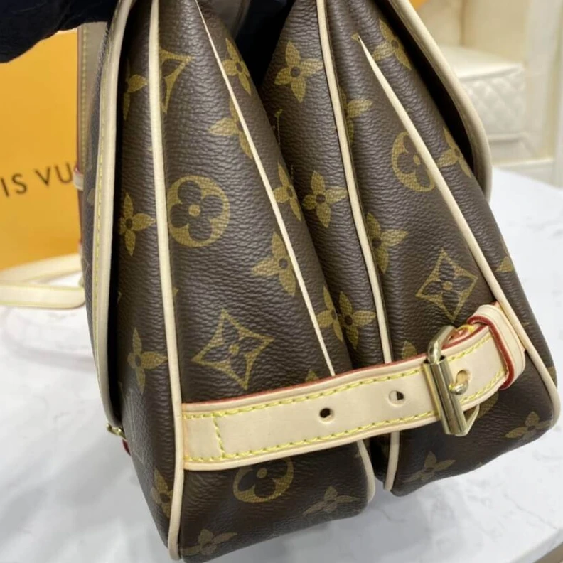 Lv belts replica Embossed Louis Vuitton Monogram Canvas Saumur MM
