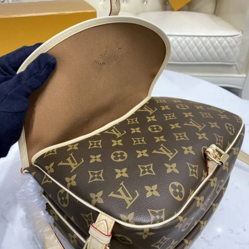 Lv belts replica Embossed Louis Vuitton Monogram Canvas Saumur MM