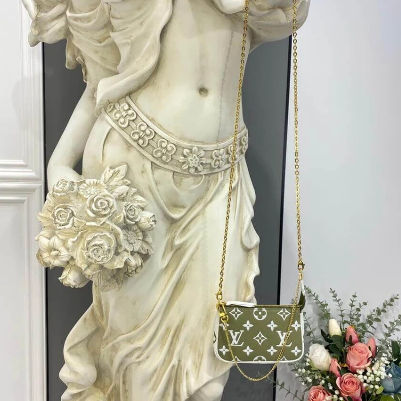Replica bag Monogram Louis Vuitton Monogram Empreinte Leather Mini Pochette Accessoires Khaki