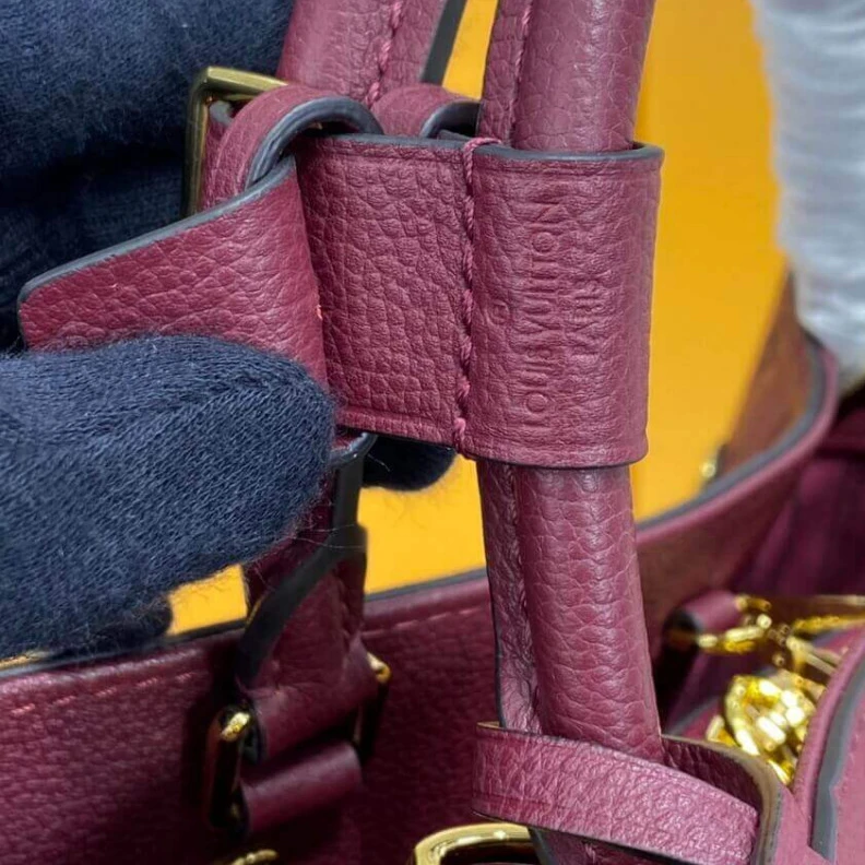 Replica bags lv Key bell Louis Vuitton Monogram Empreinte Leather Montaigne MM Burgundy