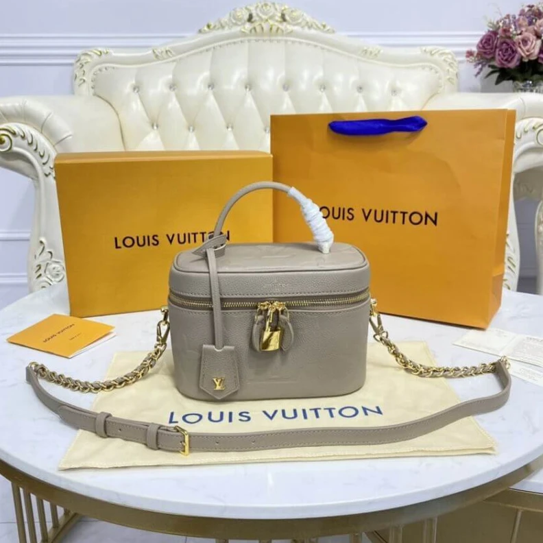 Louis vuitton locations Microfibr LV Monogram Empreinte Leather Vanity PM Dune
