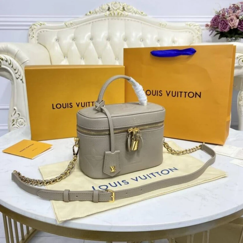 Louis vuitton locations Microfibr LV Monogram Empreinte Leather Vanity PM Dune