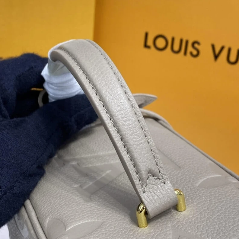 Louis vuitton locations Microfibr LV Monogram Empreinte Leather Vanity PM Dune