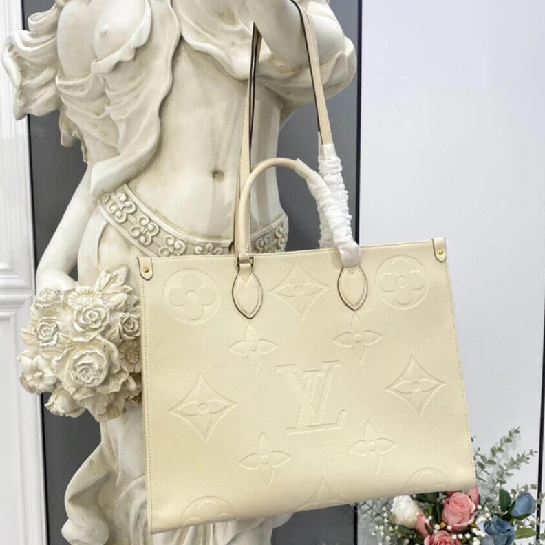 Lv belts replica Inside do Louis Vuitton Monogram Empreinte Onthego GM Beige