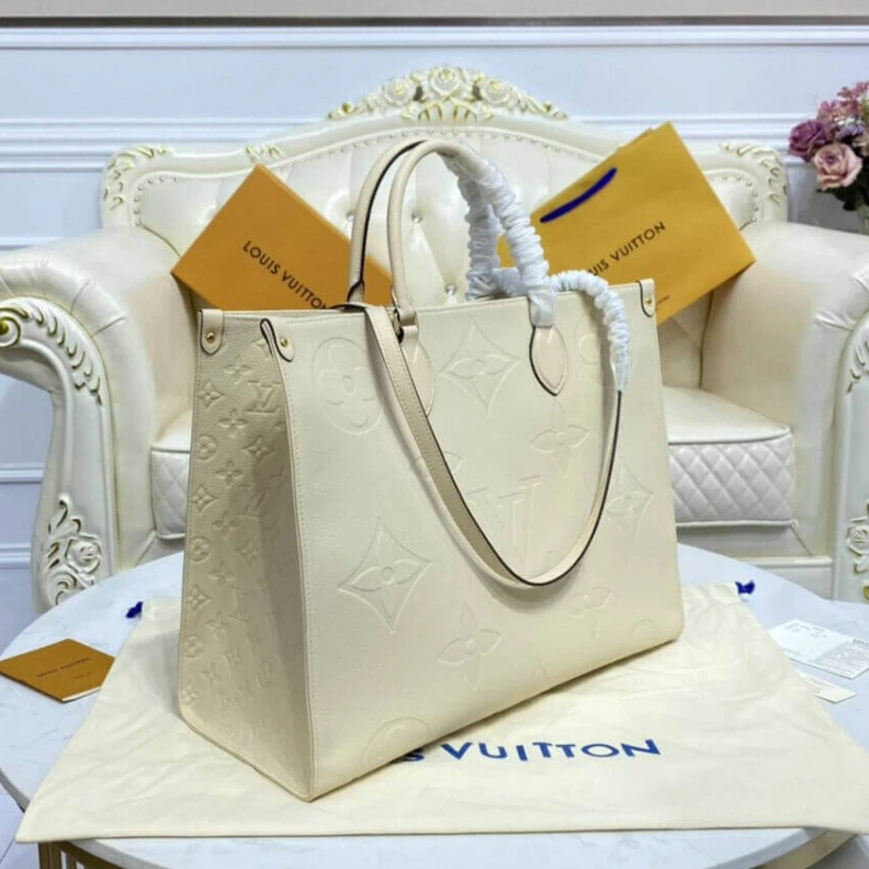 Lv belts replica Inside do Louis Vuitton Monogram Empreinte Onthego GM Beige