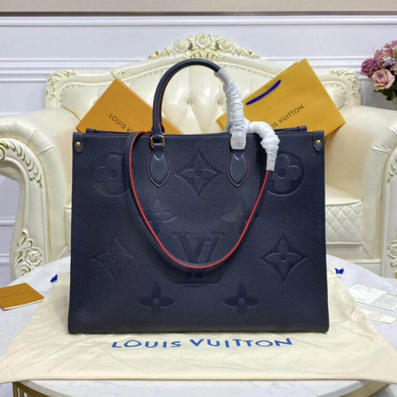 The stylis Louis Vuitton Monogram Empreinte Onthego GM Blue