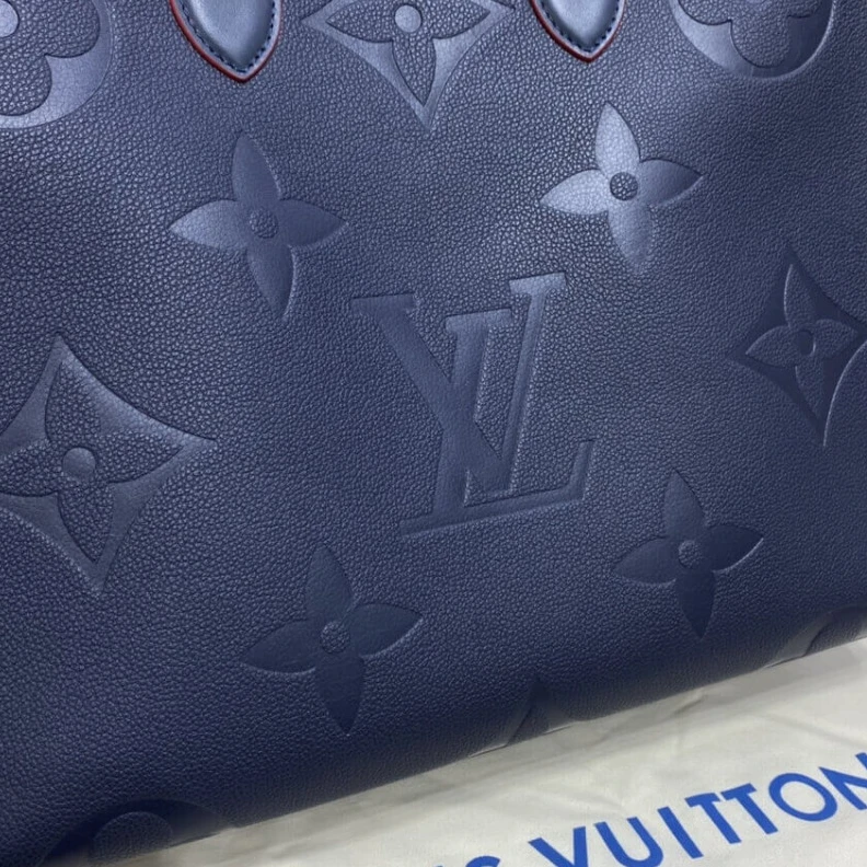 Lv belts replica The stylis Louis Vuitton Monogram Empreinte Onthego GM Blue