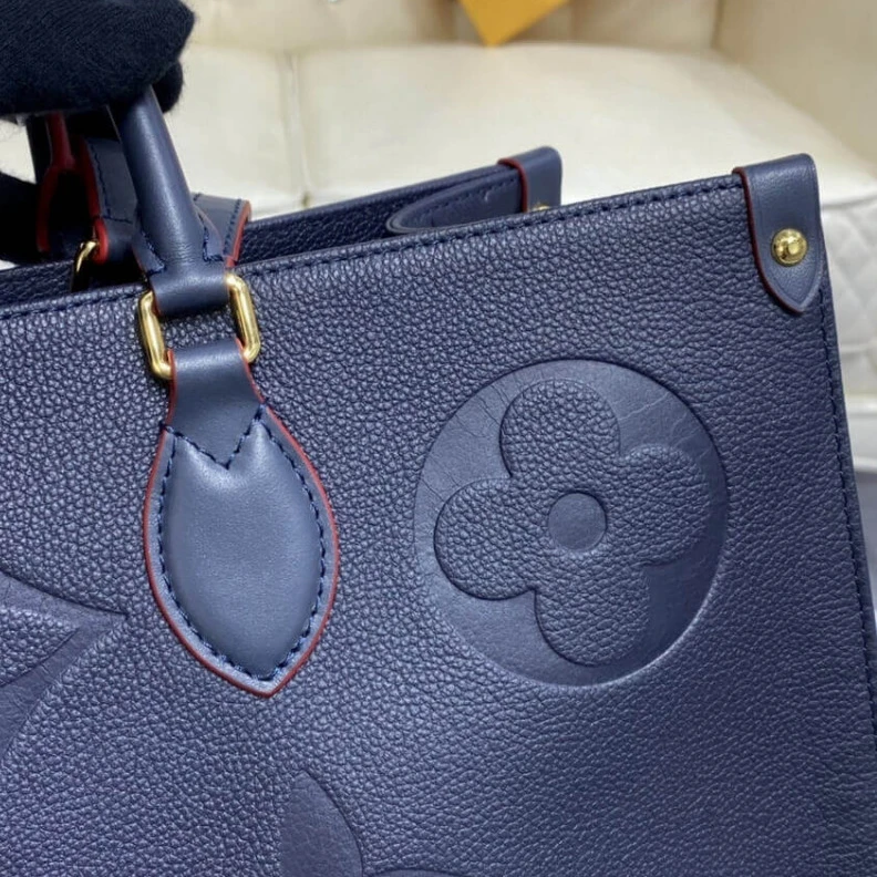 Lv belts replica The stylis Louis Vuitton Monogram Empreinte Onthego GM Blue