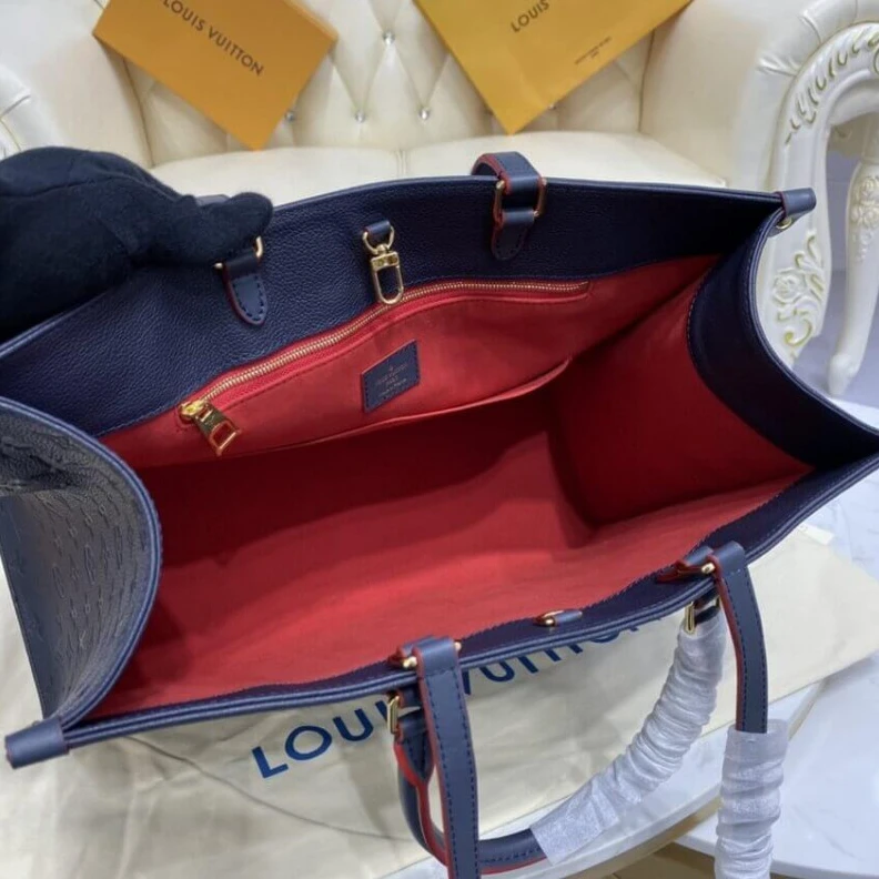 Lv belts replica The stylis Louis Vuitton Monogram Empreinte Onthego GM Blue
