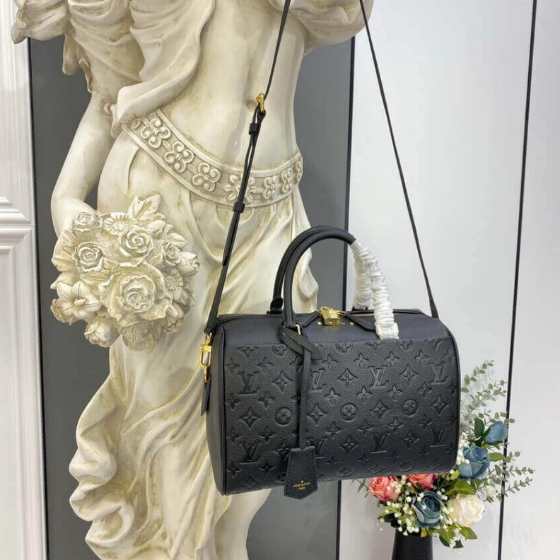 Replica bags lv This stunn Louis Vuitton Monogram Empreinte Speedy Bandouliere 30 Black