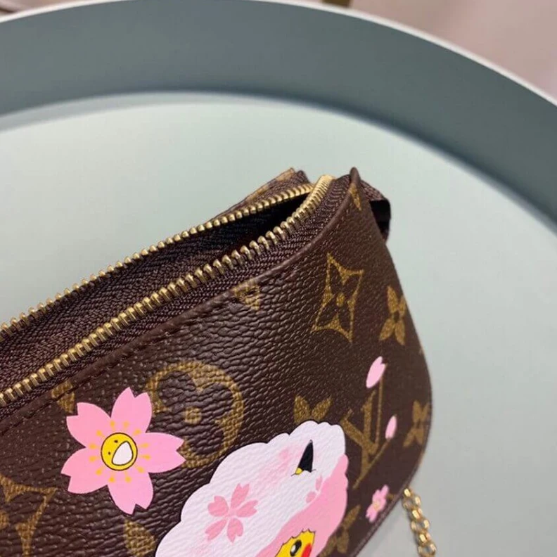 Louis vuitton locations Carried o LV Pikachu Print Mini Pochette Accessoires