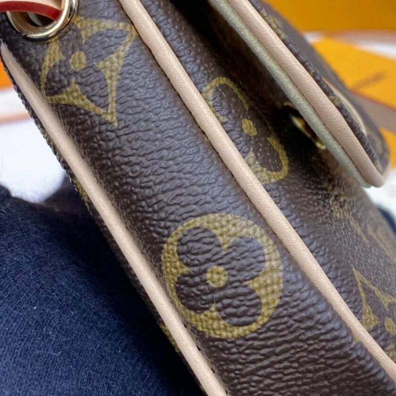 Lv belts replica This small LV Pochette Cancun Pouch
