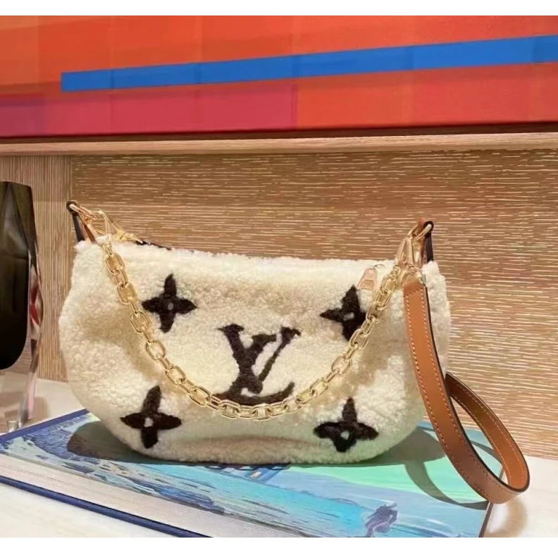 Replica bags 27.5 x 16 Louis Vuitton Ski Shearling Over The Moon Bag