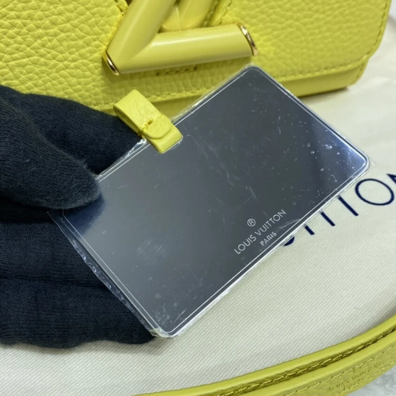 Lv belts replica Microfibe Louis Vuitton Taurillon Leather and Smooth Calfskin Twist PM Yellow