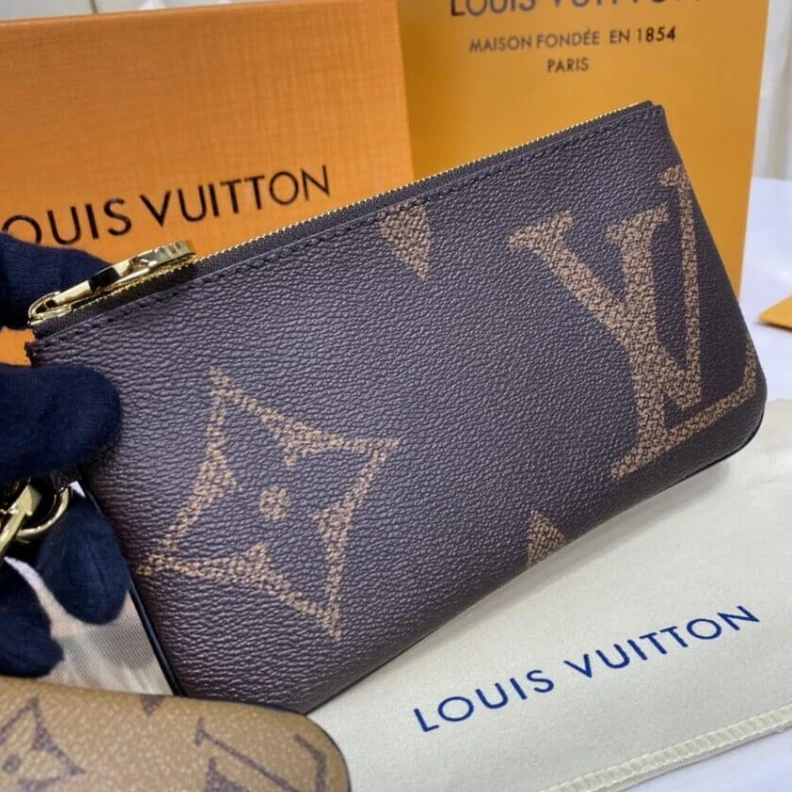 Lv belts replica Cowhidele Louis Vuitton Trio Pouch