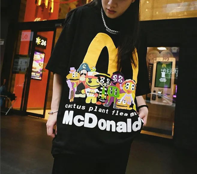 ￥129 CPFM.  X McDonald's collaboration smiley face burger family logo foam printed short sleeved t-shirt