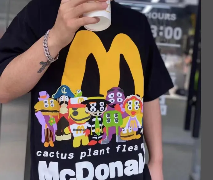 ￥129 CPFM.  X McDonald's collaboration smiley face burger family logo foam printed short sleeved t-shirt