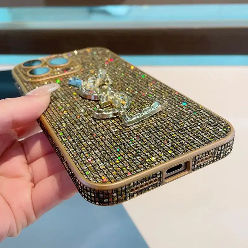 CHEAP Saint Laurent Cassandre iPhone Case In Silicon with Glitter Crystals Gold