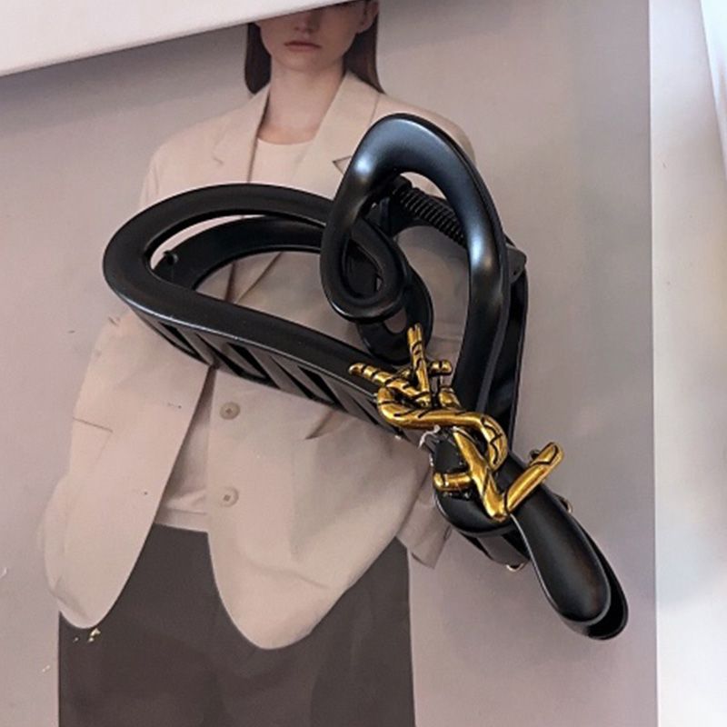 Saint Laurent Cassandre Shark Hair Clip In PVC and Steel with Bamboo Logo Black Gold