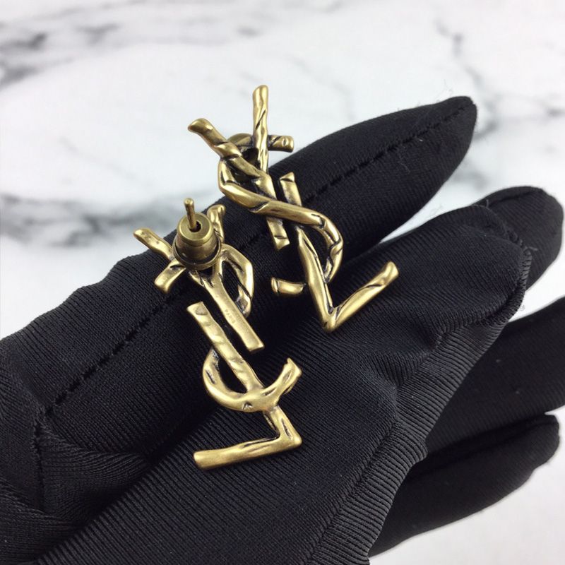 Saint Laurent Opyum Earrings In Vintage Metal Gold